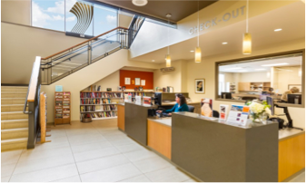 Interior of the library facing stairs and circulation desk.